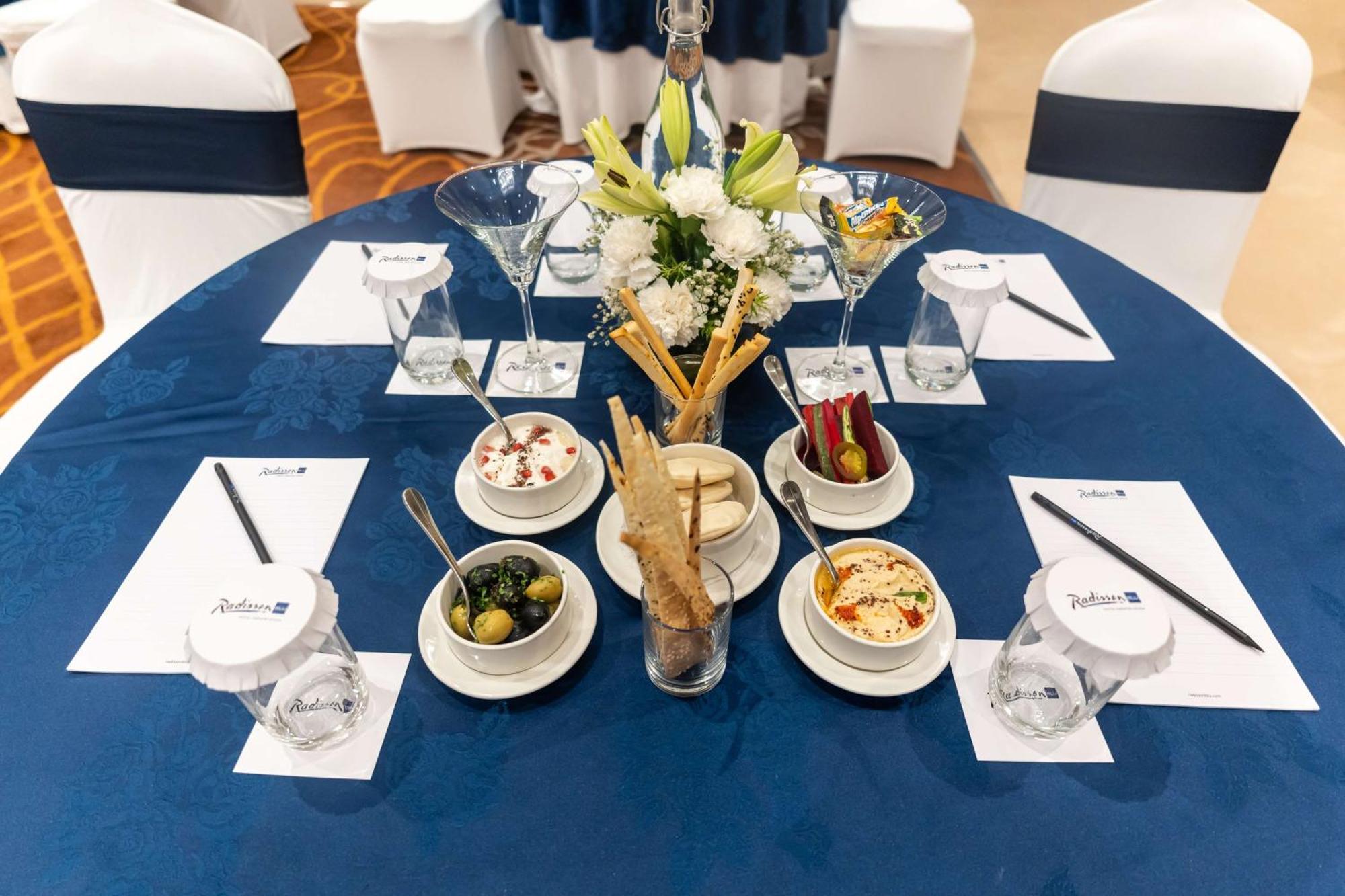 Radisson Blu Hotel, Большая Нойда Экстерьер фото A table set for a meeting
